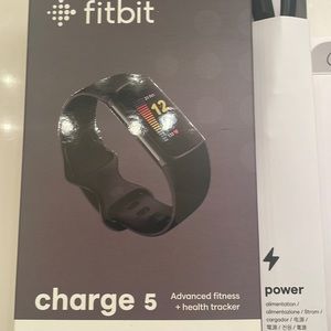Fitbit charge 5 with 2 extra cords and 2 extra bling bands.